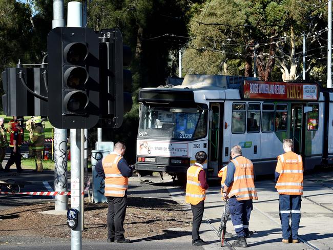 A tram derails after crashing into a truck in Parkville. Picture: Nicole Garmston