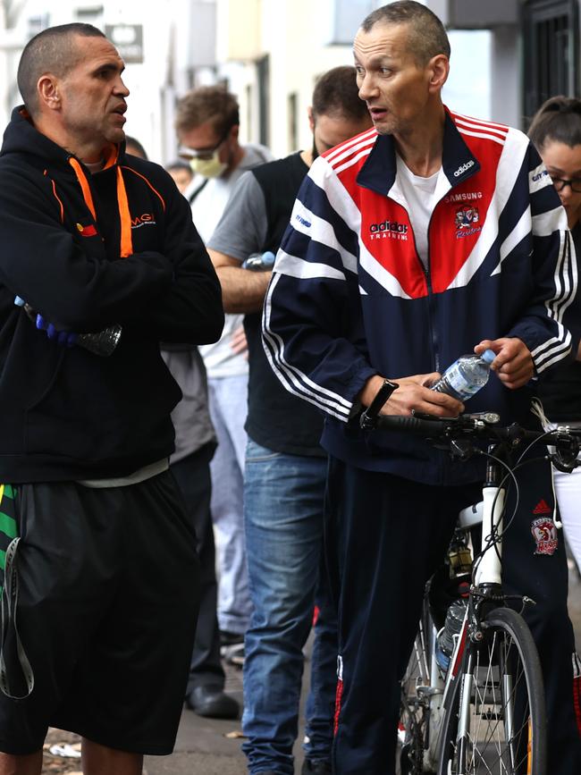 Anthony Mundine handed out water to people in the Darlinghurst Centrelink queue in Sydney. Picture: Phil Hillyard.