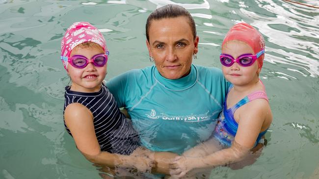 Swim school boss Skye Bond with students Lakey Emmerson and Chloe Travers, both 3. Picture: Jerad Williams