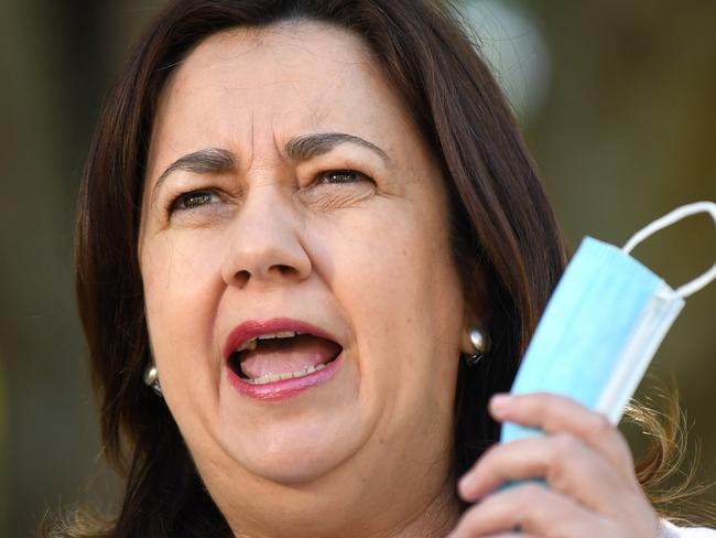 BRISBANE, AUSTRALIA - OCTOBER 03: Queensland Premier Annastacia Palaszczuk speaks during a press conference on October 03, 2021 in Brisbane, Australia. While no new Covid-19 cases were detected in the community in the past 24 hours, stage two COVID-19 restrictions are in still place across Brisbane, the Gold Coast, Moreton Bay, Logan, Townsville and Palm Island for two weeks. Only 30 people are allowed to gather in a home or in public, weddings and funerals are capped at 100 people, with a maximum of 20 allowed to dance at weddings. Restaurants and cafes will are restricted to one person per four square metres, and dancing is banned at venues. The NRL Grand Final match will go ahead tonight at Suncorp Stadium with crowd capacity capped at 75 percent.  (Photo by Dan Peled/Getty Images)