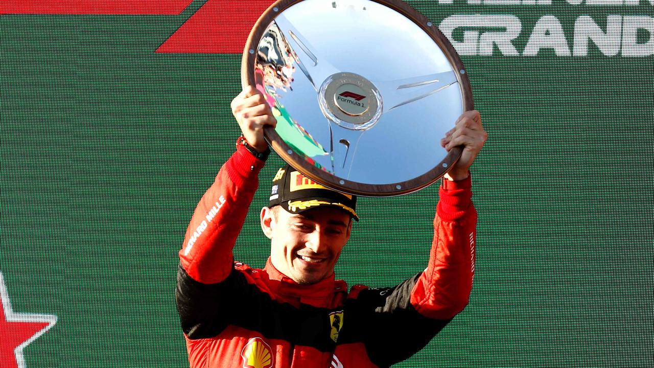 Ferrari's Monegasque driver Charles Leclerc celebrates his victory on the podium after the 2022 Formula One Australian Grand Prix at the Albert Park Circuit in Melbourne on April 10, 2022. (Photo by Con Chronis / AFP) / -- IMAGE RESTRICTED TO EDITORIAL USE - STRICTLY NO COMMERCIAL USE --