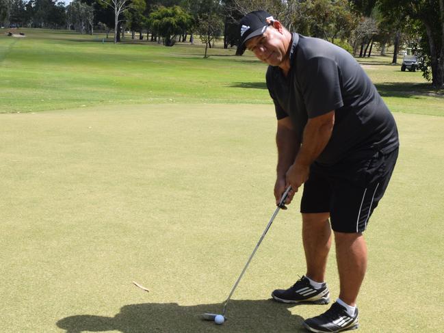 Karl Kirkwood gets ready to putt in the club championships at the Proserpine Golf Club on Saturday.