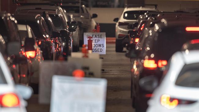 Drivers wait for in-car testing at Northland Shopping Centre. Picture: Jake Nowakowski