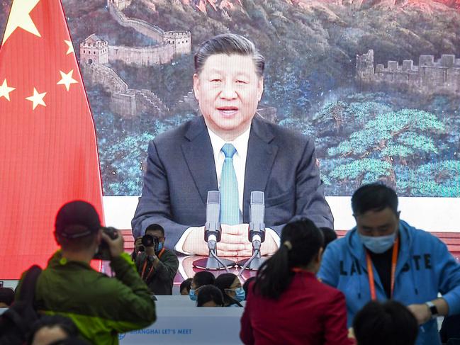 A screen shows Chinese President Xi Jinping delivering a speech via video for the opening ceremony of the 3rd China International Import Expo (CIIE) at a media centre in Shanghai on November 4, 2020. (Photo by STR / AFP) / China OUT