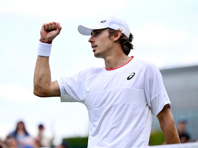 LONDON, ENGLAND - JULY 06: Alex De Minaur of Australia celebrates winning match point against Kimmer Coppejans of Begium in the Men's Singles first round match during day four of The Championships Wimbledon 2023 at All England Lawn Tennis and Croquet Club on July 06, 2023 in London, England. (Photo by Shaun Botterill/Getty Images)