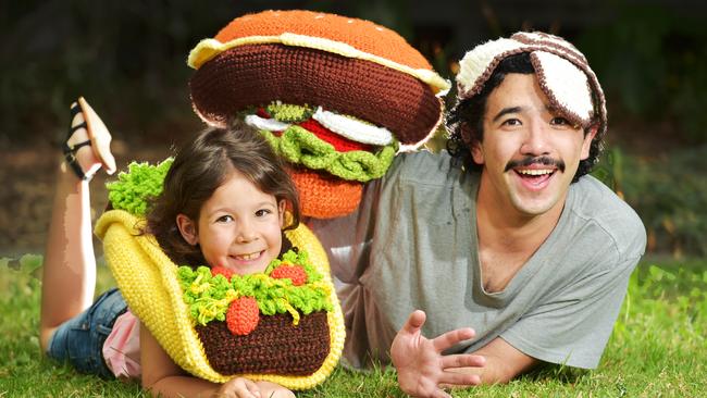 Chili Philly Phil Ferguson shows off his crazy crocheted hats with six year old Sasha Sere. Picture: Nigel Hallett