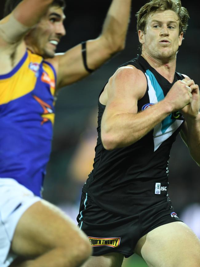 Tom Jonas braces for impact before collecting Andrew Gaff. Picture: Mark Brake