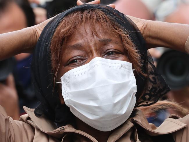 A relative of the sacristan victim of a knife attack cries in front of the Basilica of Notre-Dame de Nice in Nice on October 29, 2020. - France's national anti-terror prosecutors said Thursday they have opened a murder inquiry after a man killed three people at a basilica in central Nice and wounded several others. The city's mayor, Christian Estrosi, told journalists at the scene that the assailant, detained shortly afterwards by police, "kept repeating 'Allahu Akbar' (God is Greater) even while under medication." He added that President Emmanuel Macron would be arriving shortly in Nice. (Photo by Valery HACHE / AFP)