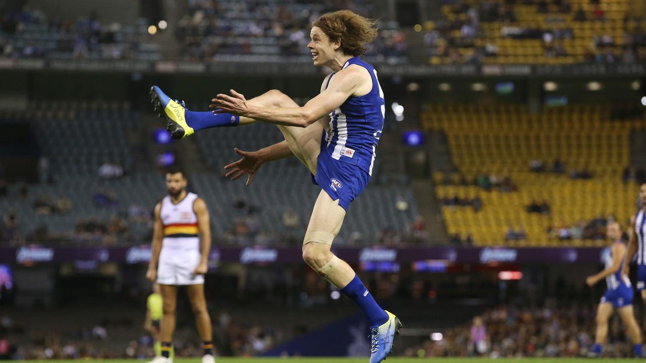 Ben Brown of the Kangaroos kicks at goal in the third quarter. Picture: Michael Klein.