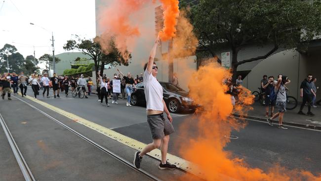 A number of flares were lit during the protest. Picture: Alex Coppel