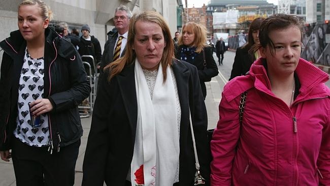 Relatives of murdered fusilier Lee Rigby, his sister Sara McClure, left, and mother Lyn Rigby, centre, arrive at the Old Bailey to attend the first day of the trial of Michael Adebolajo and Michael Adebowale. (Photo by Oli Scarff/Getty Images)