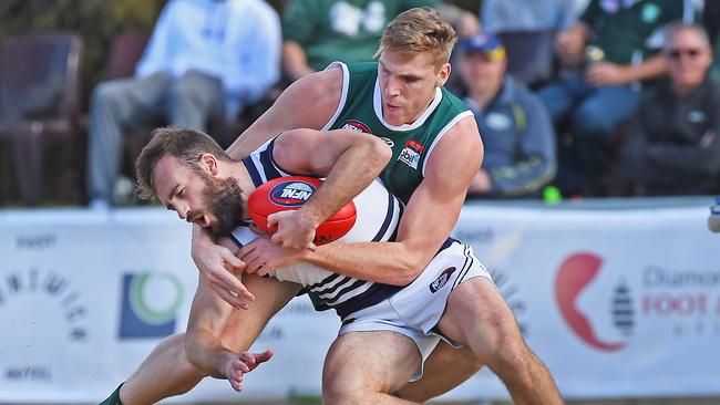 Tom Bell takes down Andrew Sturgess. Picture: Rob Leeson