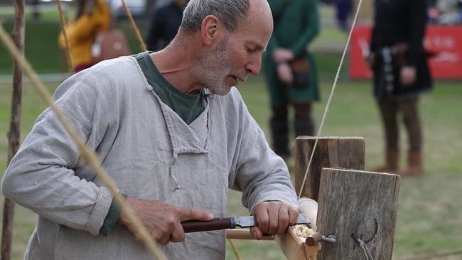 Roy Davi, "The Leura Bodger" works a pole lathe to turn his timber at Hawkesbury Showground Winterfest Medieval Festival on Saturday, July 7, 2018. The festival drew a large crowd from the Hawkesbury area who came for the food, folk music and fun. (AAP Image/David Swift)