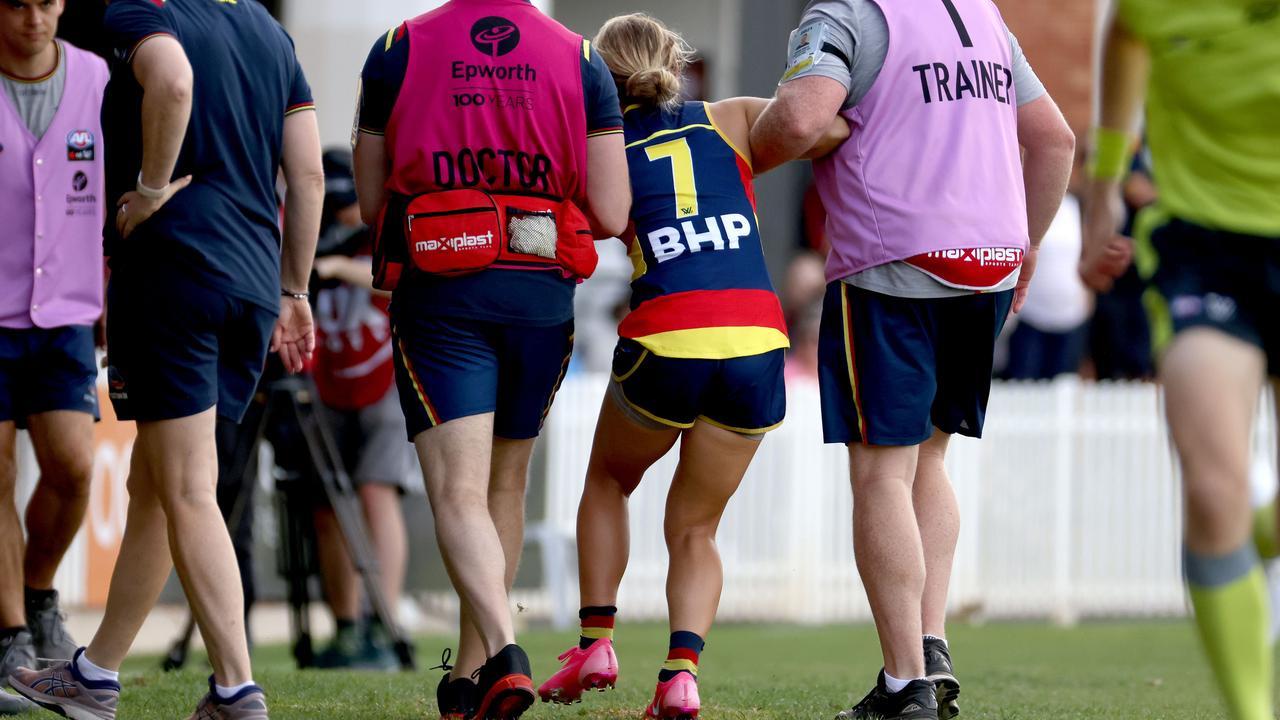 Crows defender Nikki Gore goes off injured during the 2021 AFLW Round 06 match between the Adelaide Crows and the Gold Coast Suns at Norwood Oval on March 6, 2021 in Adelaide, Australia. Picture: JAMES ELSBY/AFL PHOTOS VIA GETTY IMAGES