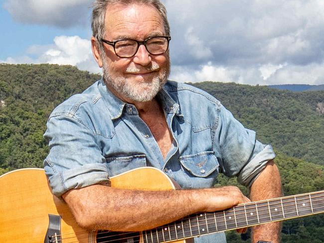 Singer song writer John Williamson at his Springbrook property. John has been sharing performances he has been capturing on his phone while in self isolation. Picture by Luke Marsden.