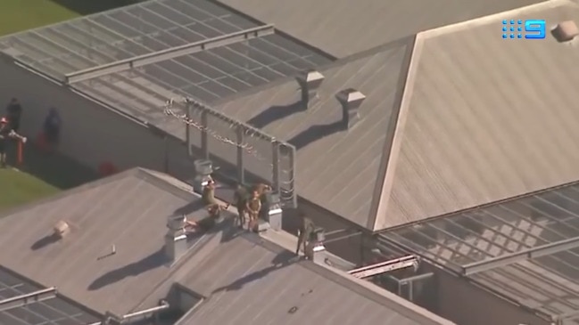 Six inmates on Borallon jail rooftop during prison riot