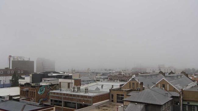 Toowoomba CBD as viewed from the roof of Grand Central as fog blankets the city, Monday, December 23, 2019. Picture: Kevin Farmer