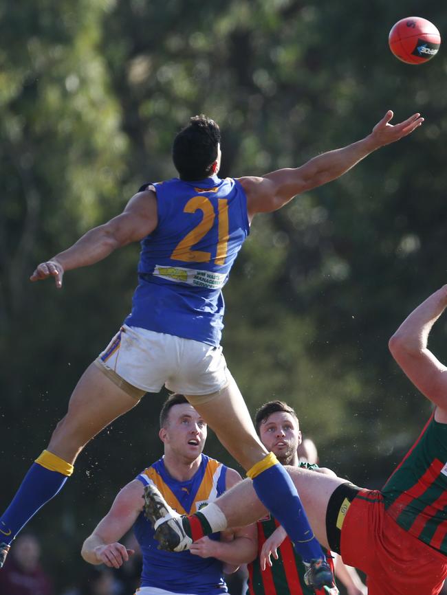 Chris Nayna flies for the ball. Picture: Stuart Milligan