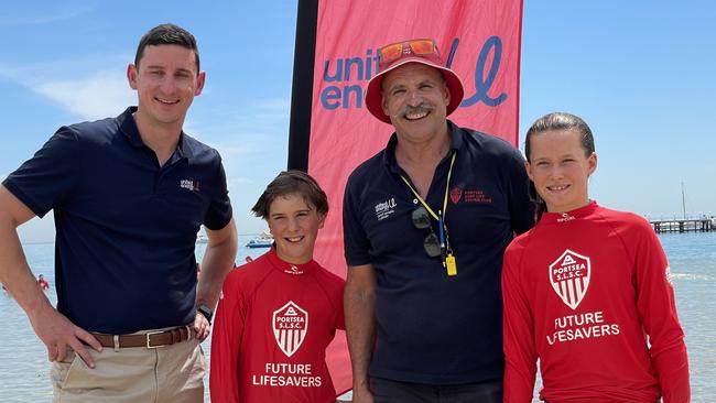 United Energy's Chris Murn (left) with Sorrento Primary students Archer Green and Sophie Day and Portsea Centre of Excellence Program director Henry Kiss. Picture Henry Yates.