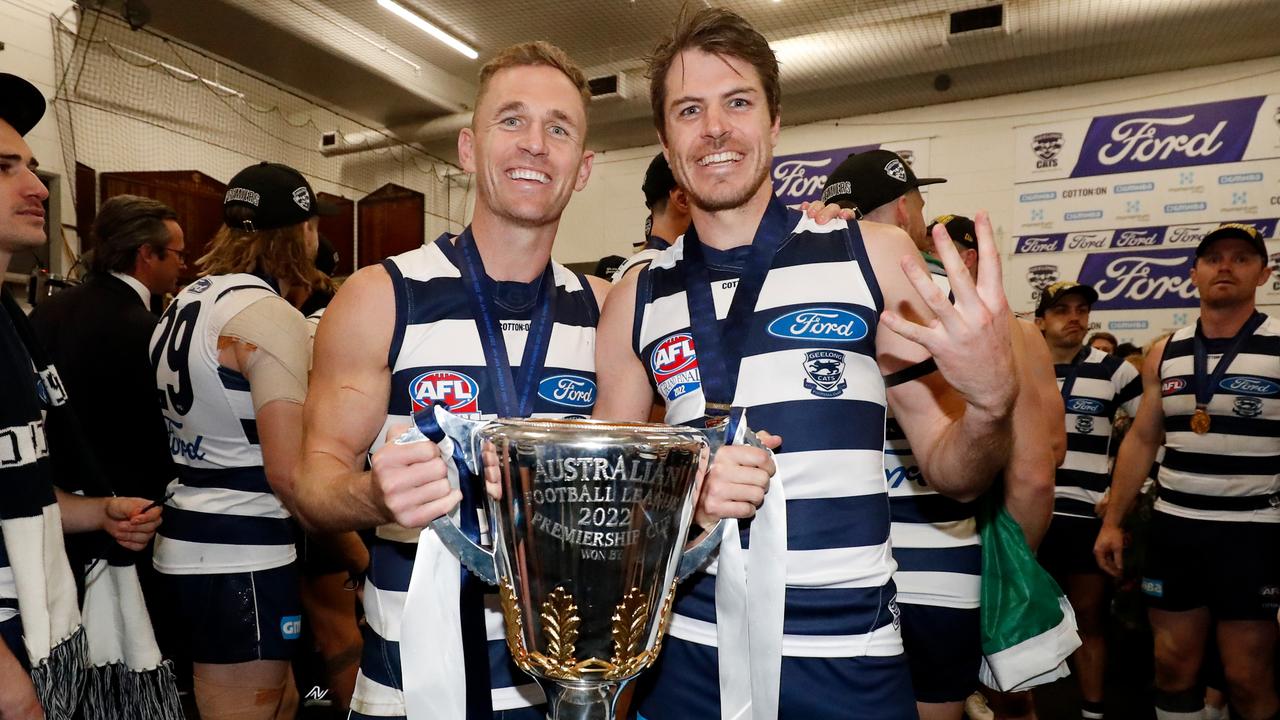 MELBOURNE, AUSTRALIA - SEPTEMBER 24: Joel Selwood and Isaac Smith of the Cats pose for a photo with the premiership cup during the 2022 Toyota AFL Grand Final match between the Geelong Cats and the Sydney Swans at the Melbourne Cricket Ground on September 24, 2022 in Melbourne, Australia. (Photo by Dylan Burns/AFL Photos via Getty Images)