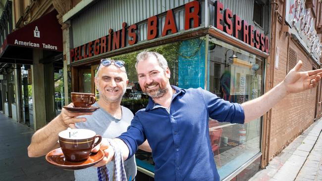 CBD cafe institution Pellegrini’s is open again, much to the delight of owner David Malaspina and Nico Di Sipio. Picture: Mark Stewart