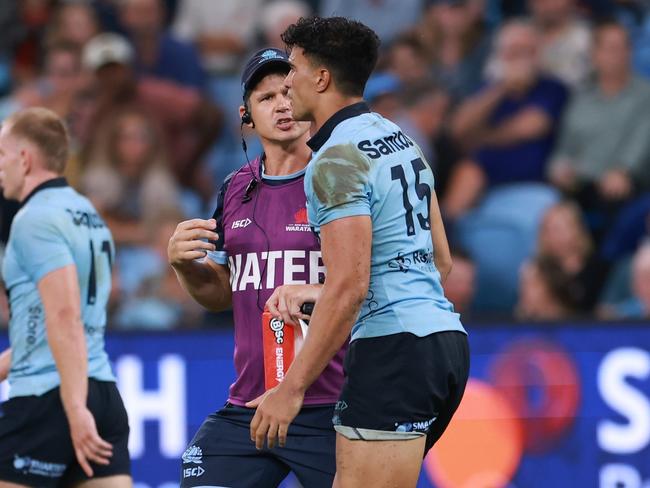 SYDNEY, AUSTRALIA - FEBRUARY 14: Joseph-Aukuso Suaalii of the Waratahs limps after a heavy tackle during the round one Super Rugby Pacific match between NSW Waratahs and Highlanders at Allianz Stadium, on February 14, 2025, in Sydney, Australia. (Photo by Darrian Traynor/Getty Images)