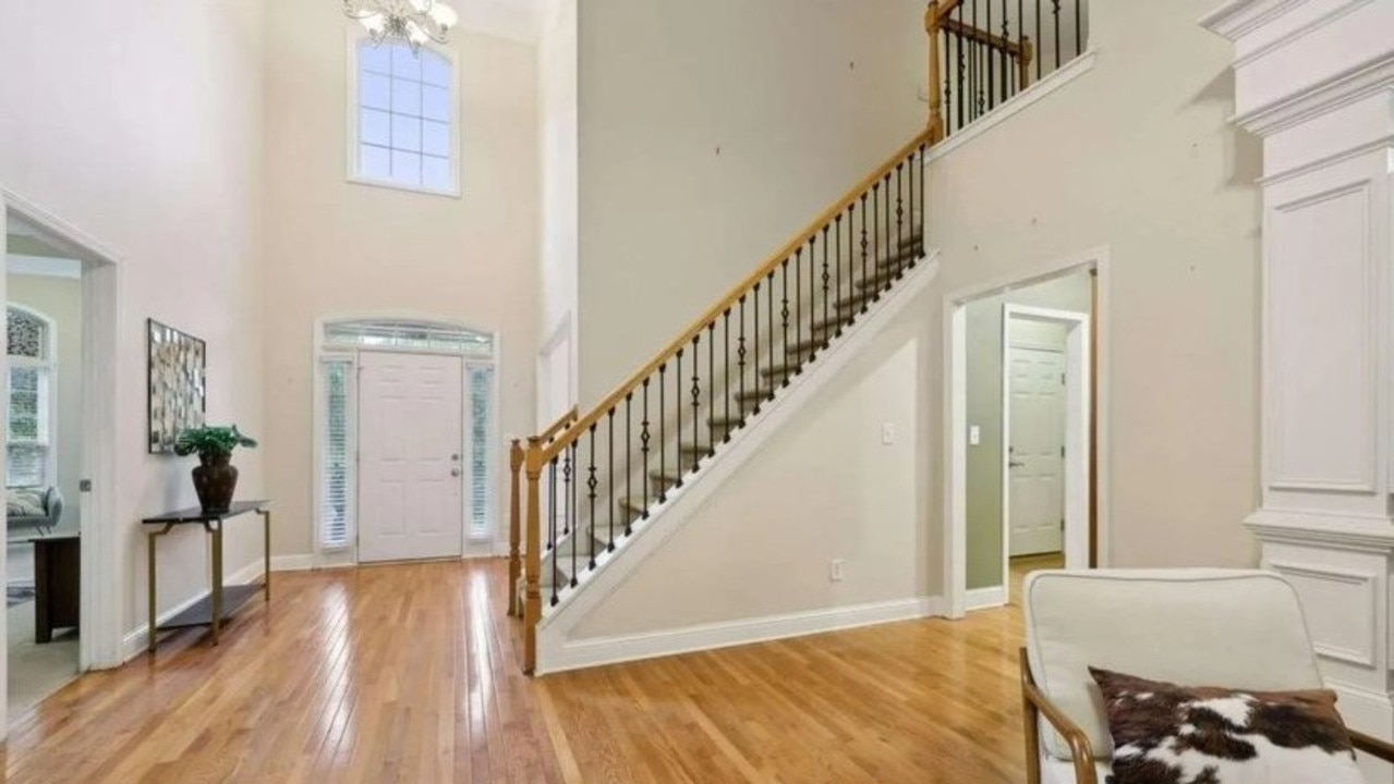 A two-storey entry leads to an open floor plan with a spacious living area. Picture: Realtor