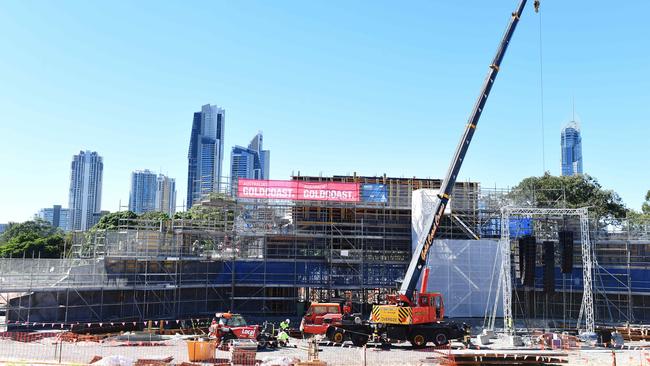 Workers at the cultural precinct site which will have Surfers Paradise in the backdrop. Picture: John Gass