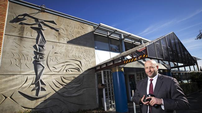 Adam Walker in front of his fathers untitled sculpture that will be incorporated into a hospital development at New Town. Picture: CHRIS KIDD