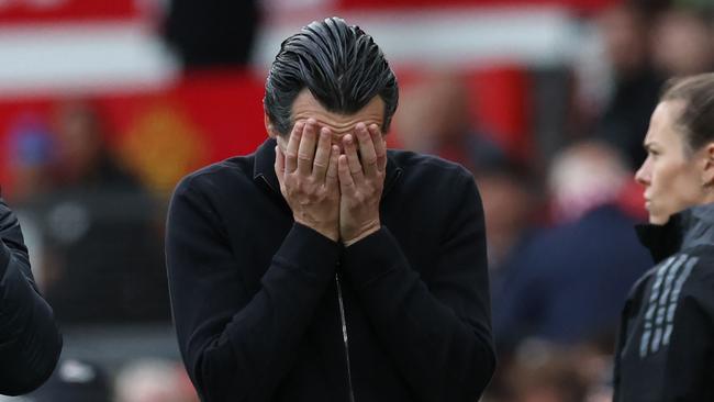 TOPSHOT - Aston Villa's Spanish head coach Unai Emery reacts as he leaves after the English Premier League football match between Manchester United and Aston Villa at Old Trafford in Manchester, north west England, on May 25, 2025. United won the game 2-0. (Photo by Darren Staples / AFP) / RESTRICTED TO EDITORIAL USE. No use with unauthorized audio, video, data, fixture lists, club/league logos or 'live' services. Online in-match use limited to 120 images. An additional 40 images may be used in extra time. No video emulation. Social media in-match use limited to 120 images. An additional 40 images may be used in extra time. No use in betting publications, games or single club/league/player publications. /