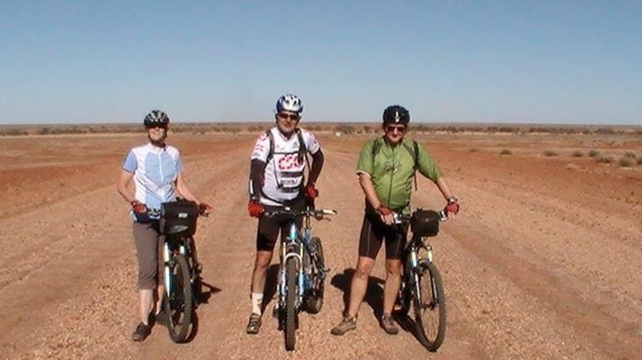 Former Central Queensland barrister Ross Lo Monaco and Supreme Court judge Justice Peter Dutney in the Australian outback on a riding holiday in 2009. The woman in the photo was the other rider, not known to the men prior to the holiday, who rode through the deserts on this trip.