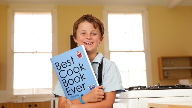 Tottenham Central School student Harry Chase, 10, who designed the cover of the schools fundraising cookbook "Best Cook Book Ever — Probably". Picture: Jonathan Ng