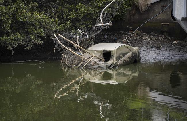 The car was finally removed after more than three months in Cook River. Picture: Matthew Vasilescu