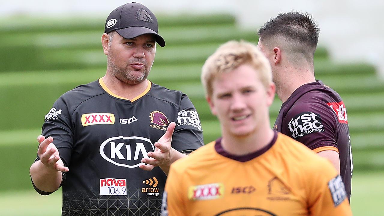 Captain Alex Glenn talking with coach Anthony Seibold, with Tom Dearden in the foreground.