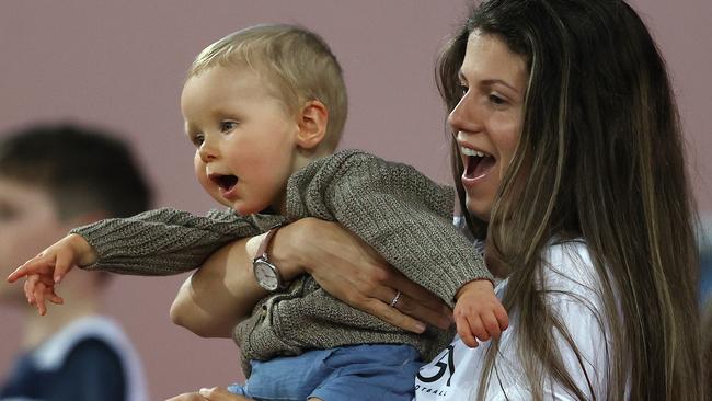 Jordan Ablett and son Levi cheer on dad Gary. Picture: Michael Klein