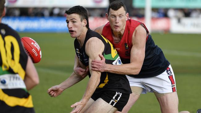 Chris Carey (right) in action for Mt Eliza. Picture: Andrew Batsch