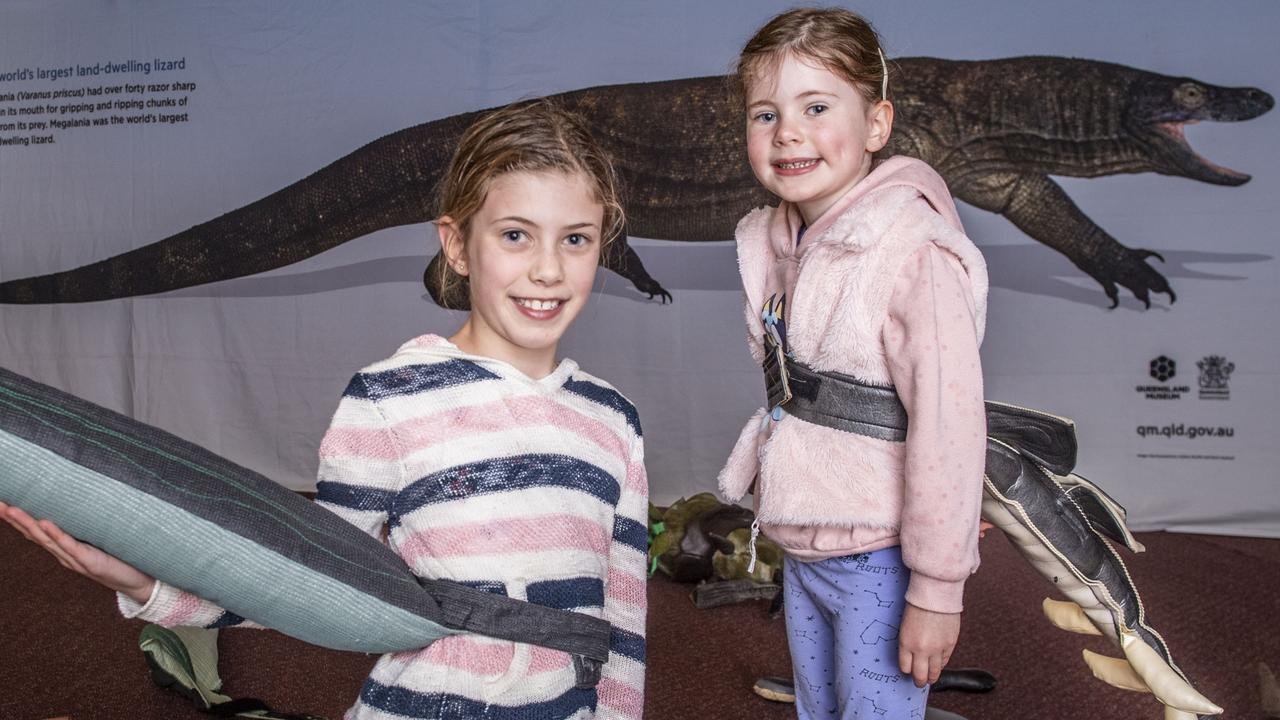 Sisters, Lucy (10) and Georgia (5) Sharpe get their dinosaur on at the Thrive on Arts, Empire Theatre. Sunday, October 2, 2022. Picture: Nev Madsen.