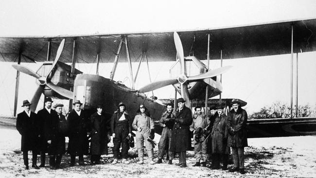 Ross and Keith Smith, James Bennett, Wally Shiers and supporters with their converted Vickers Vimy plane just before take-off at Hounslow Heath. Picture: State Library of South Australia