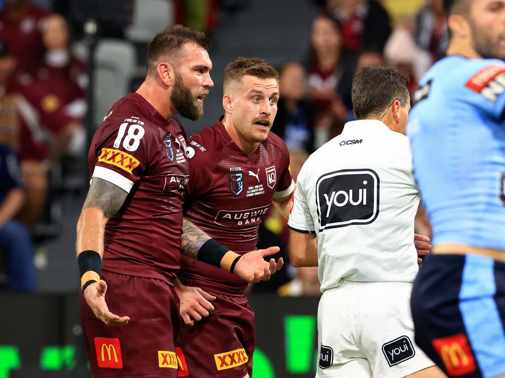 Kyle Feldt and Cameron Munster remonstrate with the referee.