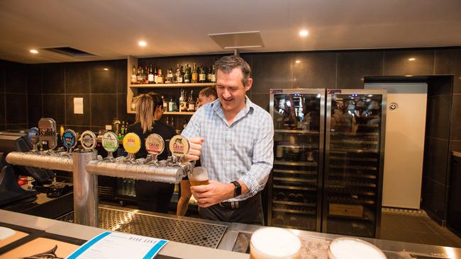 Chief Minister Michael Gunner Pours a Schooner at The Revamped Cavenagh Hotel. Picture Glenn Campbell