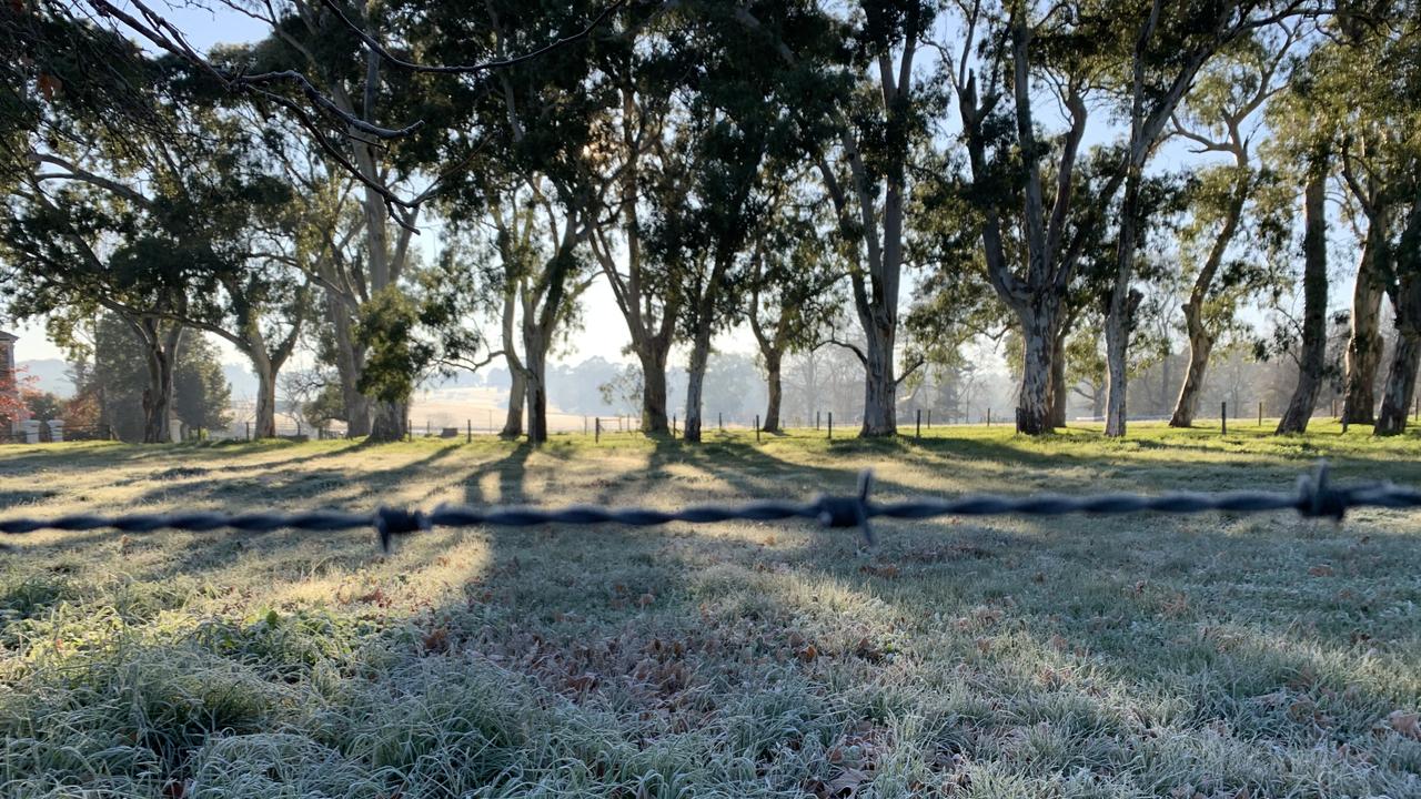 The sun rises over an empty paddock at the Oakbank Racecourse. Picture: Emily Dawe