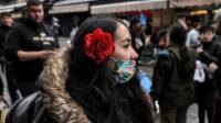 People wearing masks due to the COVID-19 coronavirus pandemic walk at in Jerusalem. Picture: AFP