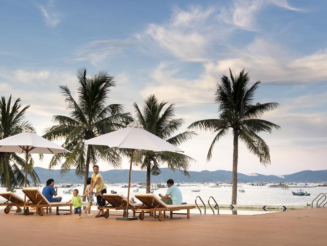 The resort is near the beach "A Stop" in Phu Yen province, Vietnam - May 31, 2018: Tourists are watching the sunset on the sea at the "A Stop" resort in Phu Yen province, Vietnam