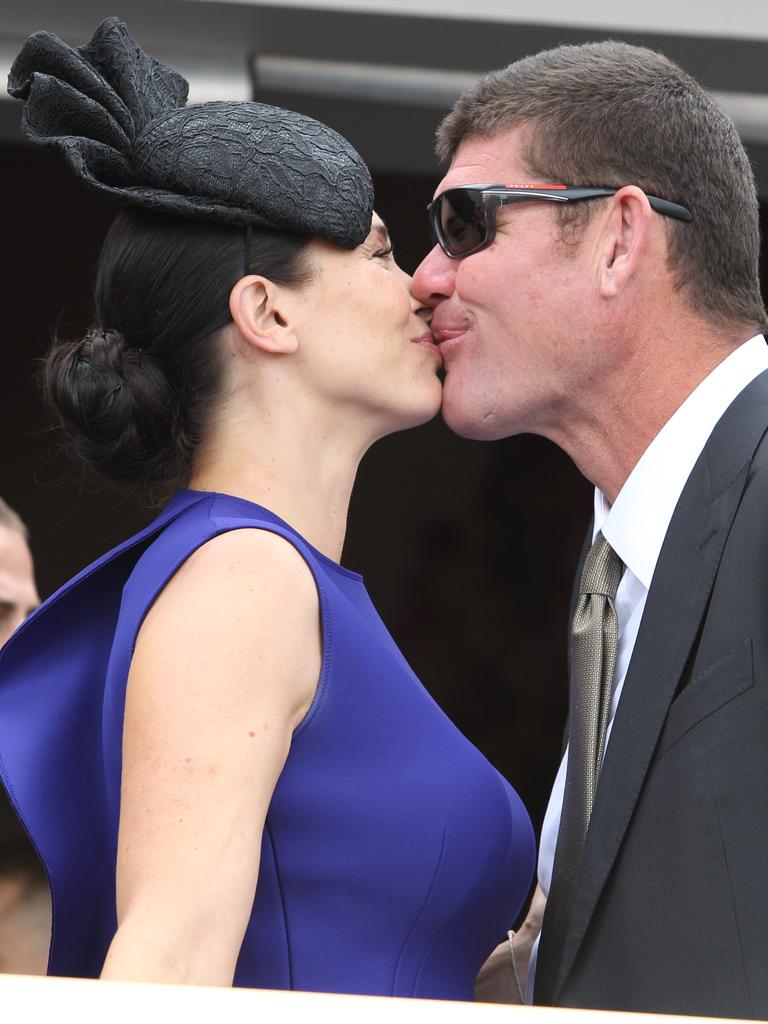 James and Erica Packer enjoy a kiss.