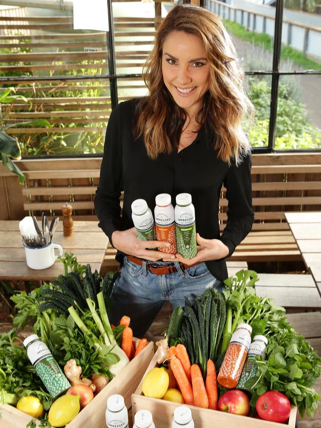 Rachael Finch with her line of cold-pressed juices. Picture Norm Oorloff