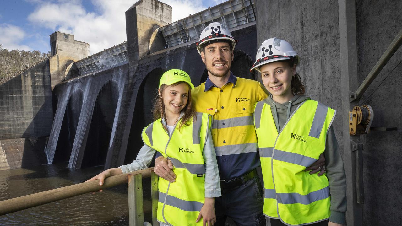 Hydro Tasmania regional production manager Martin Doyle with his daughters Kirra, 12, and Darci, 8, at the Meadowbank Dam and power station north of New Norfolk. Picture: Chris Kidd