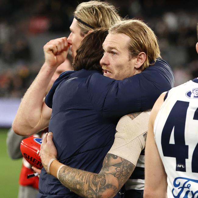 Geelong coach Chris Scott hugs tom Stewart after todays 3 point win over Richmond . Photo by Michael Klein