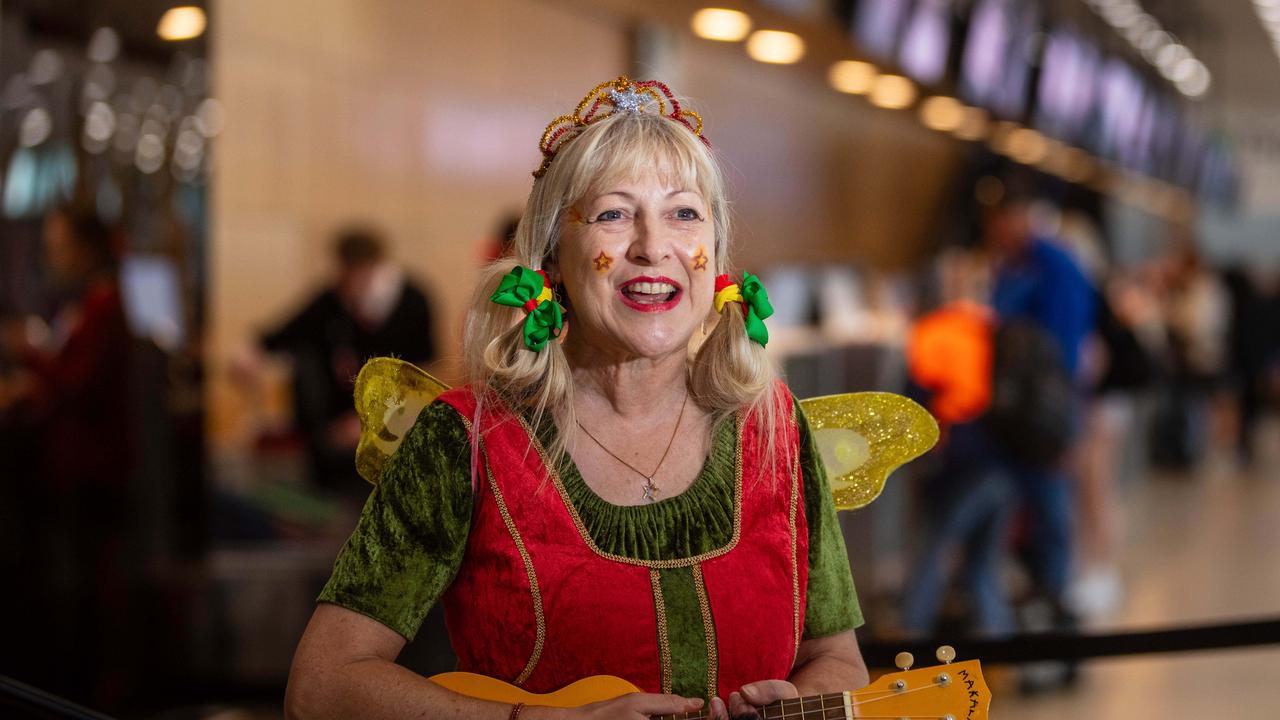 Christmas Fairy Michelle Pears who is entertaining children awaiting flights in Hobart Airport. Picture: Linda Higginson