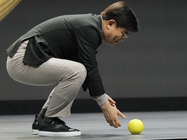 Hyun-Suk Kim, president and CEO of the Consumer Electronics Division at Samsung, demonstrates Ballie, an AI rolling robot. Picture: AP