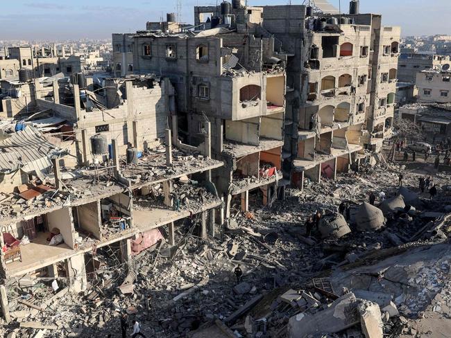 A destroyed building and the rubble of the al-Faruq mosque on February 22, 2024, following an overnight Israeli air strike in Rafah refugee camp in the southern Gaza Strip, amid continuing battles between Israel and the Palestinian militant group Hamas. Picture: AFP)